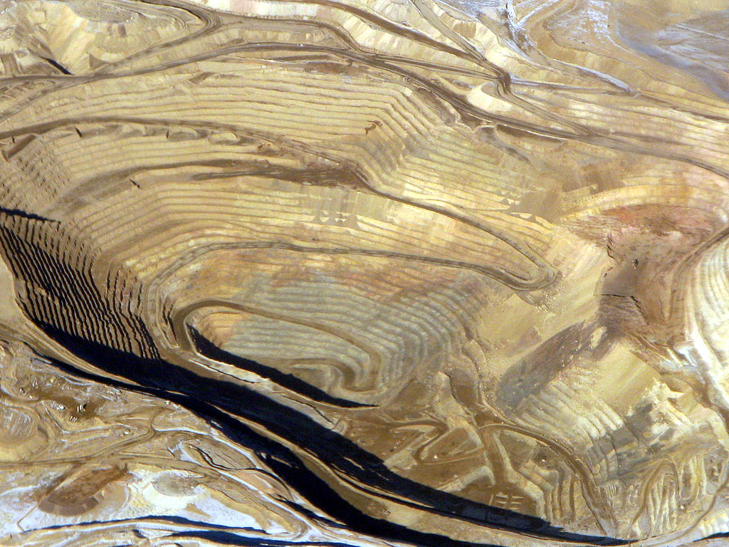 Round Mountain Gold Mine. Pic from https://upload.wikimedia.org/wikipedia/commons/thumb/3/32/Round_Mountain_gold_mine%2C_aerial.jpg/1024px-Round_Mountain_gold_mine%2C_aerial.jpg
